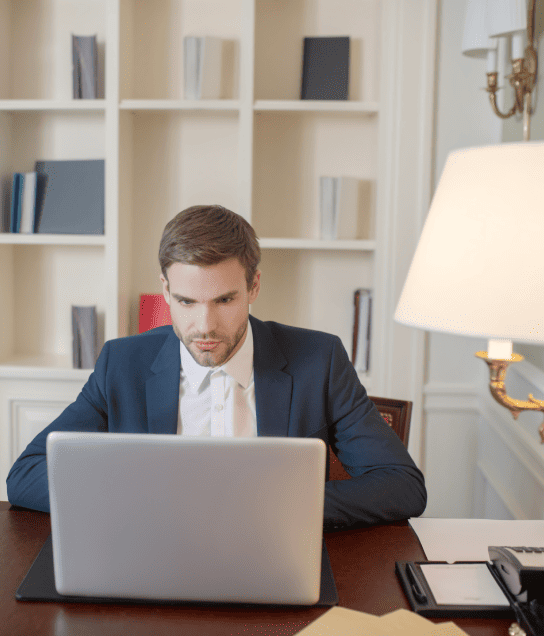 Professional working on a laptop, emphasizing legal document translation services in Milwaukee and official documents.
