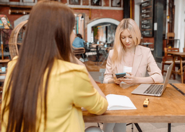 A translators compares two-language contact details after Business Card Translation Services for multilingual communication.