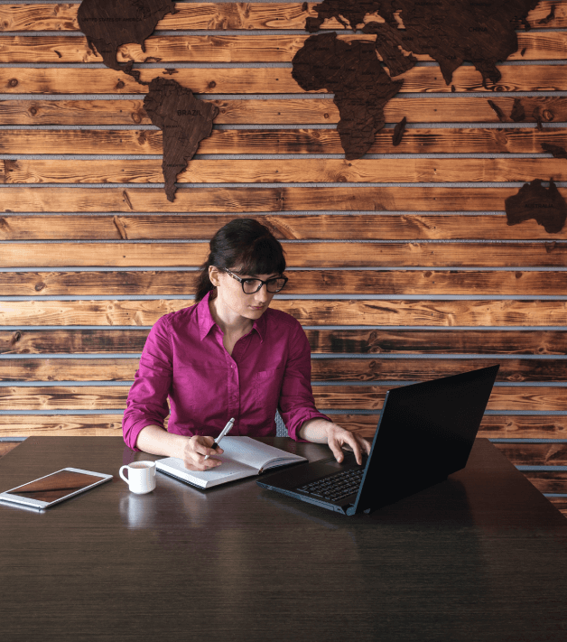 Translator working on multilingual handbook translations, ensuring clarity for employees across diverse languages.