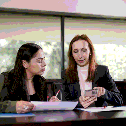 A project manager reviews a multilingual contract draft as Memphis Translation Services aligns tone and key business terms.
