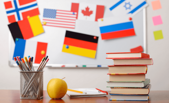 Book with flags of various countries in the background, suggesting multilingual translations in Dallas.