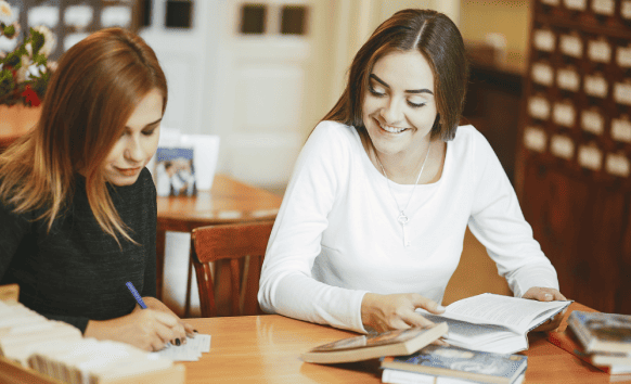 A translator working on academic documents, benefiting students through Oklahoma City Translation Services for accuracy.