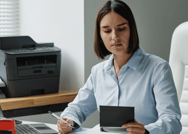 A translator ensuring accurate financial document translation, benefiting customers through Oklahoma City Translation.