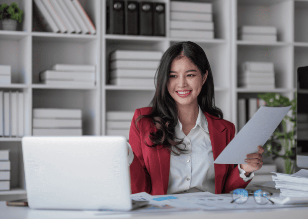 Business professional working on a laptop, ensuring certified and accurate passport translation services.