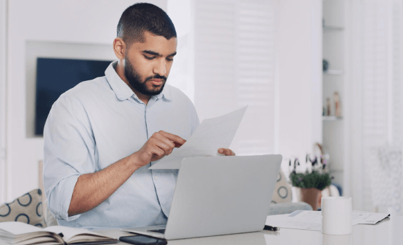 A linguist proofreads a legal NDA while Contract Translation Services verify defined terms, dates, and signatures.