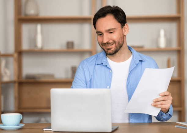A client reads a certified pricing rate sheet from Yuma Translation Services showing per-word and per-page fees.