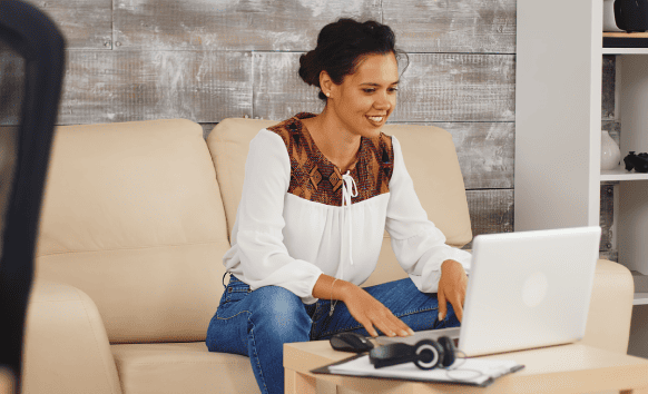 A woman works on a laptop, representing fast and reliable rush translation services for urgent communication needs. A woman works on a laptop, representing fast and reliable rush translation services for urgent communication needs.