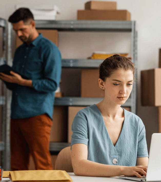 A woman working on a laptop symbolizes easy ordering and dedicated post-delivery support for sworn translation services.