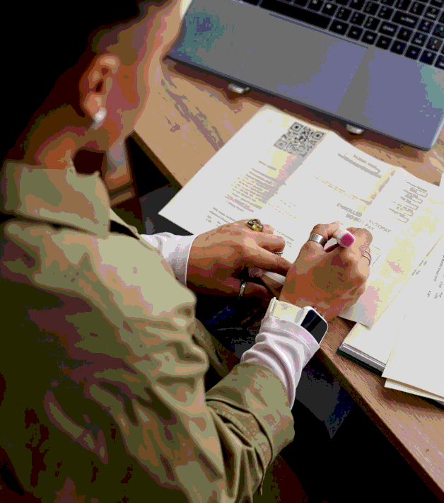 A technician follows a translated repair manual as Enterprise Translation Services keeps technical steps and warnings clear.