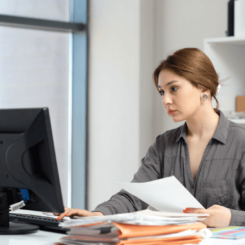 Confident translator working on the documents, representing government tender translation services for compliance.