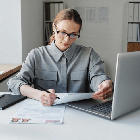 A translator prepares academic records for USCIS with transcript translation services, supporting immigration applications.