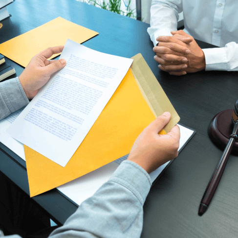 A translator reviewing detailed documents, emphasizing specialized translation for law enforcement & policy paperwork. A translator reviewing detailed documents, emphasizing specialized translation for law enforcement & policy paperwork.