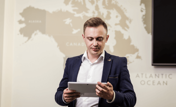 Real estate professional reviewing translated building inspection reports, & certificates for international transactions. Real estate professional reviewing translated building inspection reports, & certificates for international transactions.