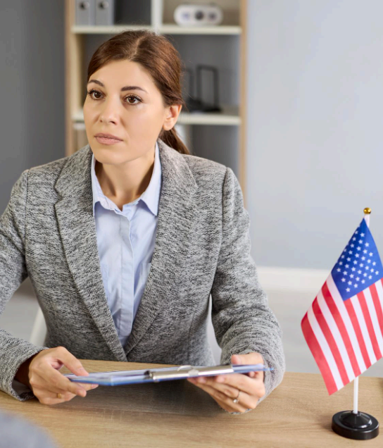 A translator checks a USCIS document checklist while Tagalog Translation Services format immigration pages for review.