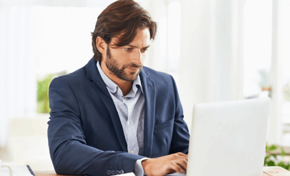A translator formats a license translation for Driver's License Translation Services for DMV use.