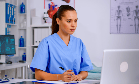 An expert using translated health manuals created through professional medical manual translation services.