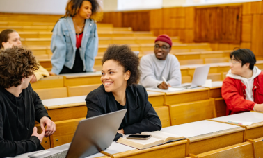 University students seeing translated educational material on laptop Translation Services