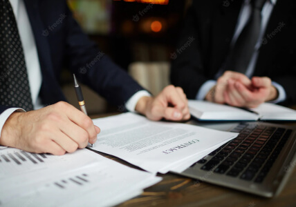 Businessman Reading Contract Papers