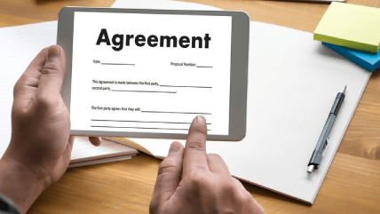 Hands holding a agreement in tablet, showcasing culturally adapted translation services for context-sensitive communication. Hands holding a agreement in tablet, showcasing culturally adapted translation services for context-sensitive communication.