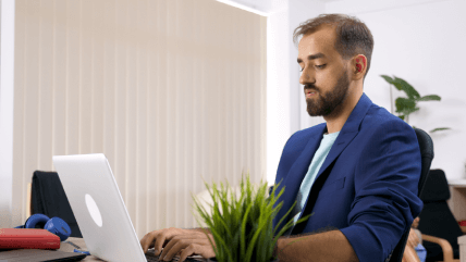 Hebrew translator working on a laptop, representing certified Hebrew translation services with guaranteed accuracy. Hebrew translator working on a laptop, representing certified Hebrew translation services with guaranteed accuracy.