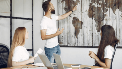 A diverse team collaborating with a laptop for international agreement contract translations for broader market reach. A diverse team collaborating with a laptop for international agreement contract translations for broader market reach.