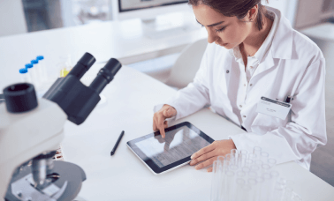 A scientist reviews documenting research data for the accuracy and reliability of life science research translations. A scientist reviews documenting research data for the accuracy and reliability of life science research translations.