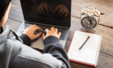 High-angle view of clock and a translator providing fast life science translation services that maintain high quality. High-angle view of clock and a translator providing fast life science translation services that maintain high quality.