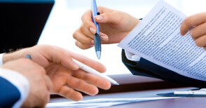 Native translators working on a document translation for immigration.