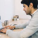 A man working on a certified spanish translation.