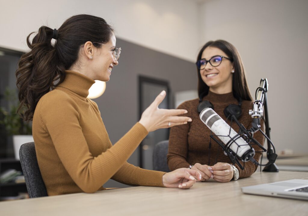 Two women discussing the Right Audio Translation Service Providers