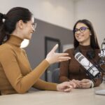 Two women discussing the Right Audio Translation Service Providers